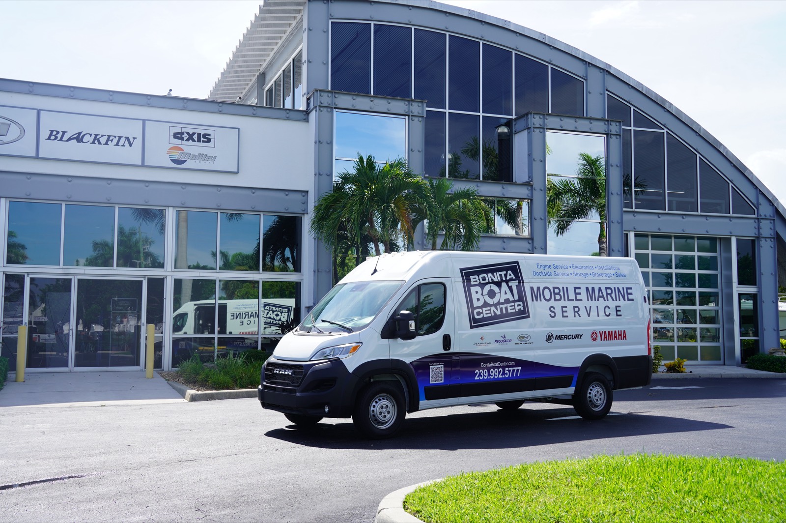 Bonita Boat Center Mobile Marine Service van parked in front of the dealership